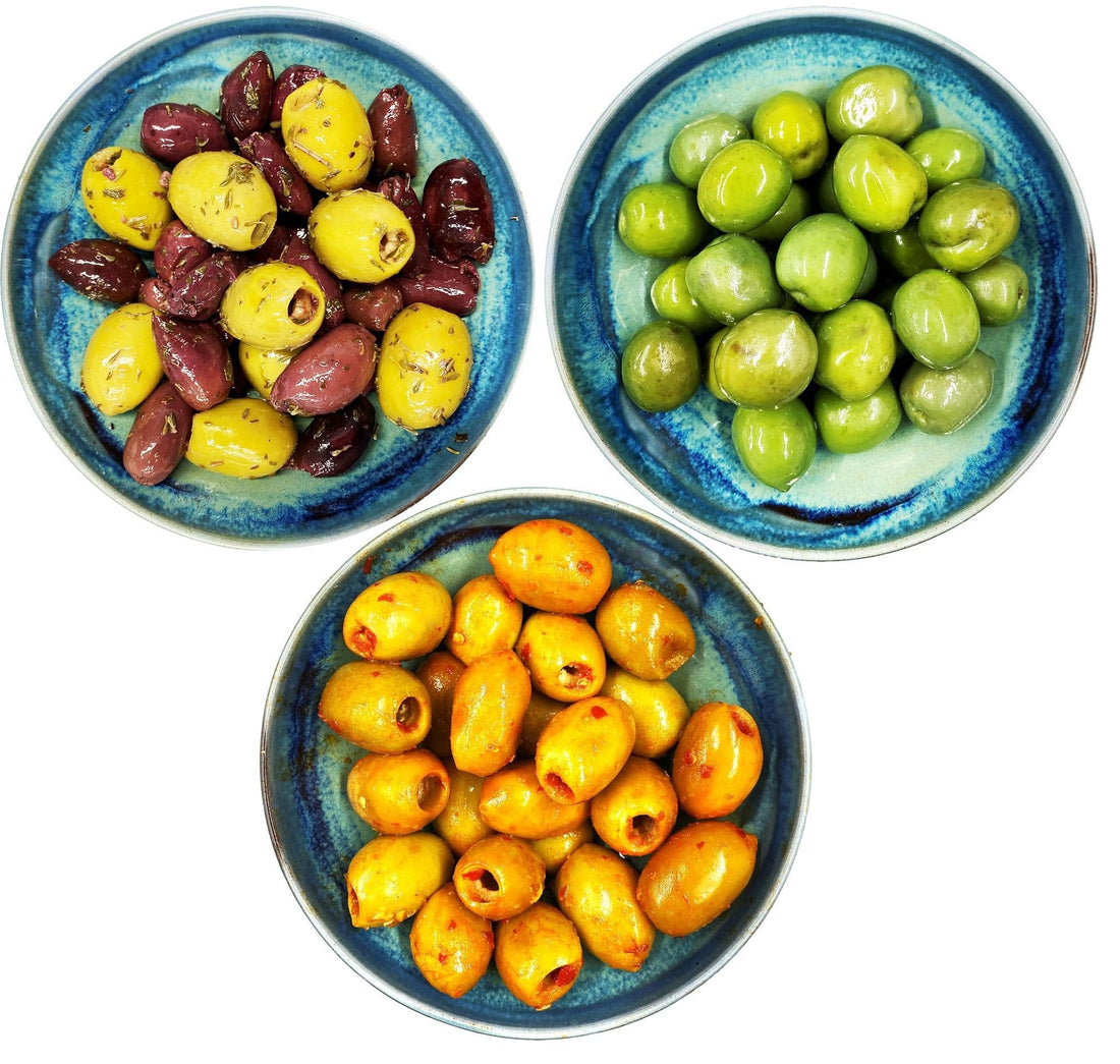 Different varieties of olives in bowls