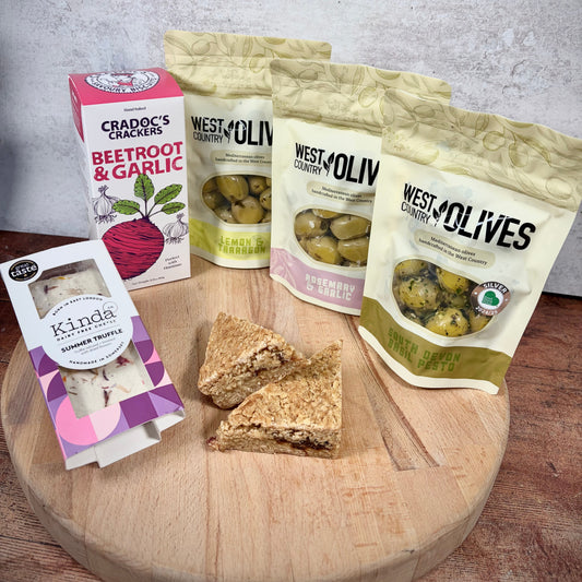 Summer Vegan Hamper, Basil pesto vegan and nut free olives, rosemary and garlic olives, lemon and tarragon olives, crackers, summer truffle cheese and date and apple vegan flapjack 